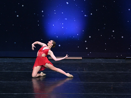 Emma performs her dance recital.