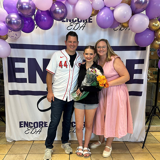 Emma and her parents.