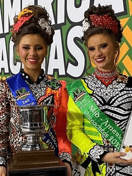 Erin and Cate smile together.