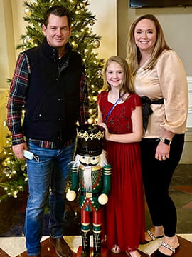 Emma and her parents.