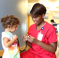 A photo of a nurse with a patient.