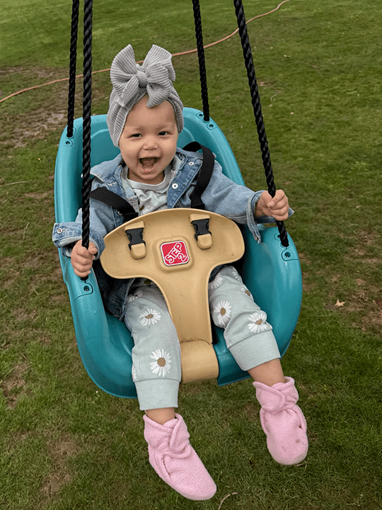 Raegan has always enjoyed swinging.