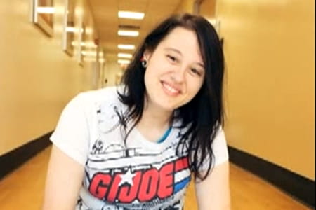 Weight loss surgery patient sitting in a hallway.
