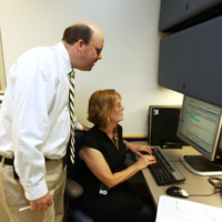 A doctor taks to a staff member at the Surgical Weight Loss Program for Teens.