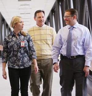 Dr. Rich Falcone (right), Director of Trauma Services at Cincinnat Children's, discusses an upcoming simulation session with Sanford Hospital trauma team members Dr. Scott Engum and Ceann Huber, RN.