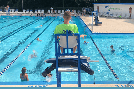 Anthony sits on his lifeguard chair.