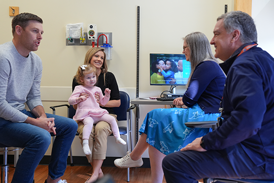 Colette's family talks with care team.