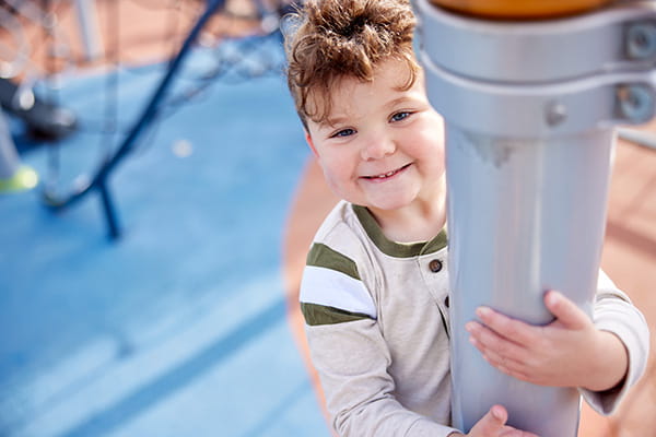 A photo of a boy smiling.