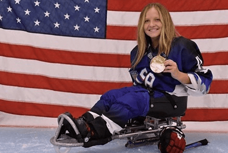 Jamie shows off her medal.
