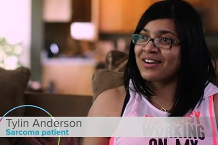 Cancer survivor talking to the camera.