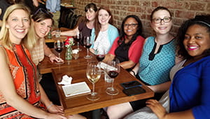 Bianca Russell, Katie Edmunds, Emily Pratt, Kourtney Gardner, Brittany Taylor, Jennifer Tasman and Deonna Johnson enjoy wine and conversation.