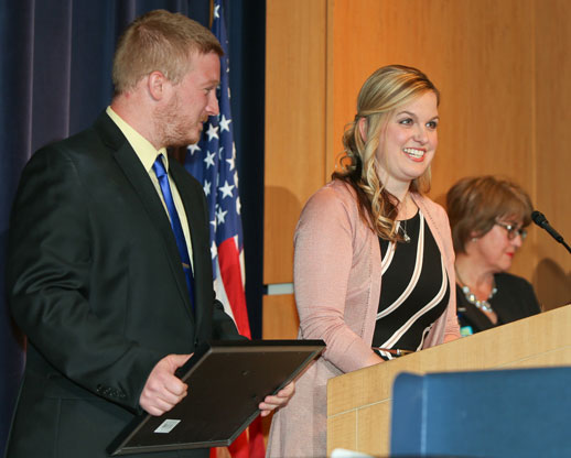 Tiffany and Keith Messer accept the award on behalf of their son's physician, Dr. Nicolas Madsen.
