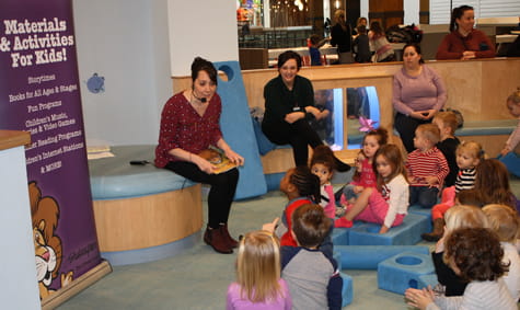 A group of children reading together.