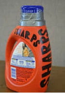 Detergent bottle used for sharps.
